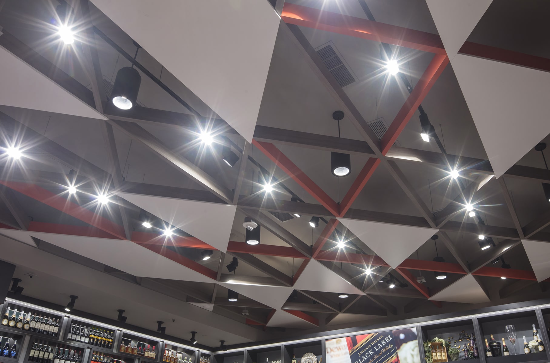 Modern ceiling design with bright lighting.