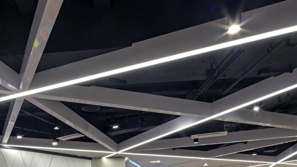 A spacious room with bright ceiling lights.