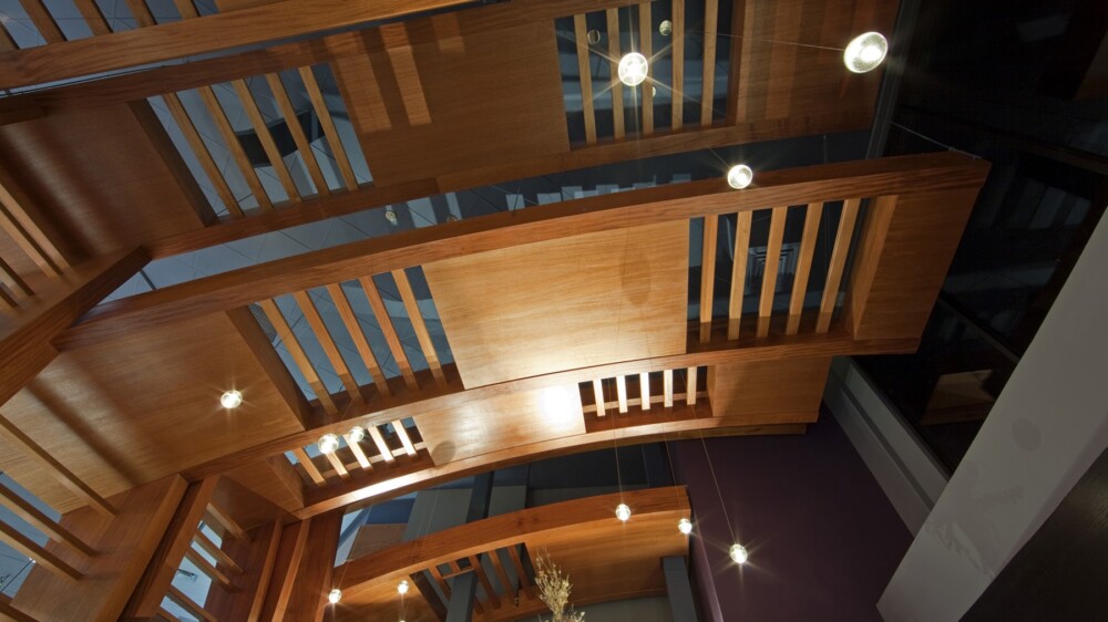Interior view of a building's ceiling, showcasing intricate architectural design.